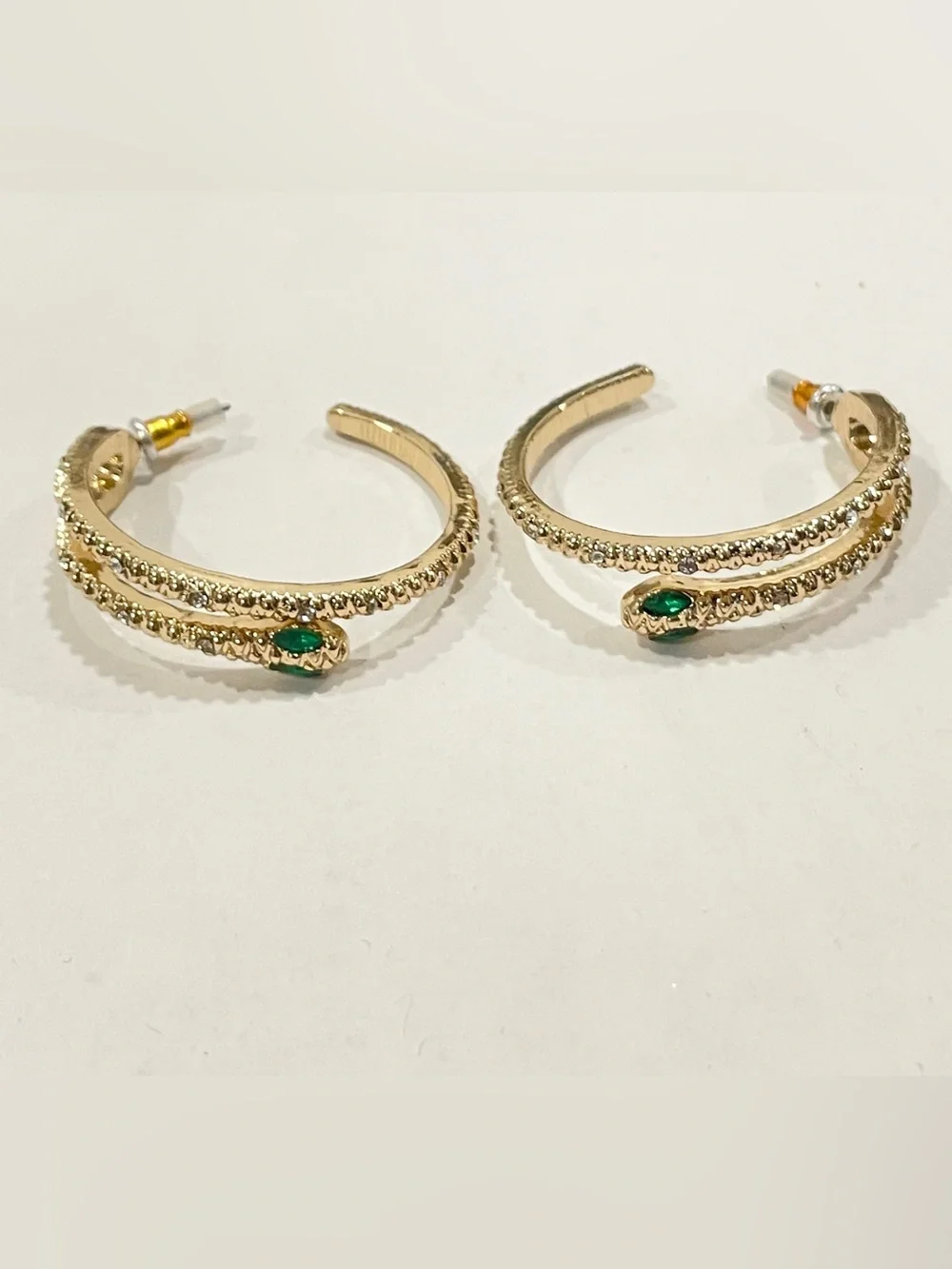 Gold Sparkle Snake Hoop Earrings with Green Eye Stone Accents